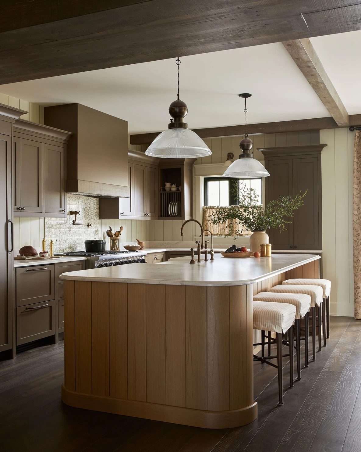 brown kitchen with rounded island