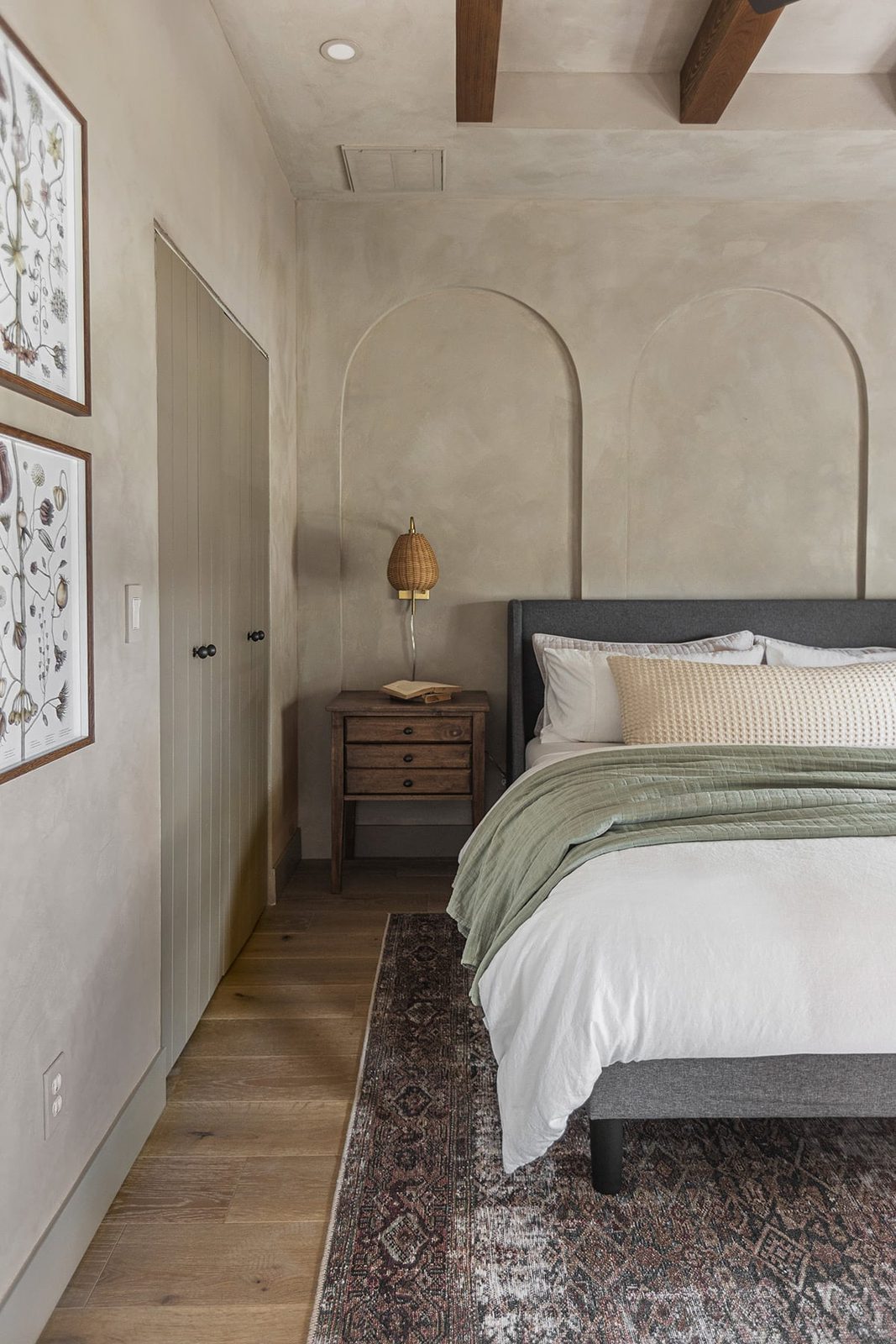 bedroom with soft taupe lime wash walls and arches