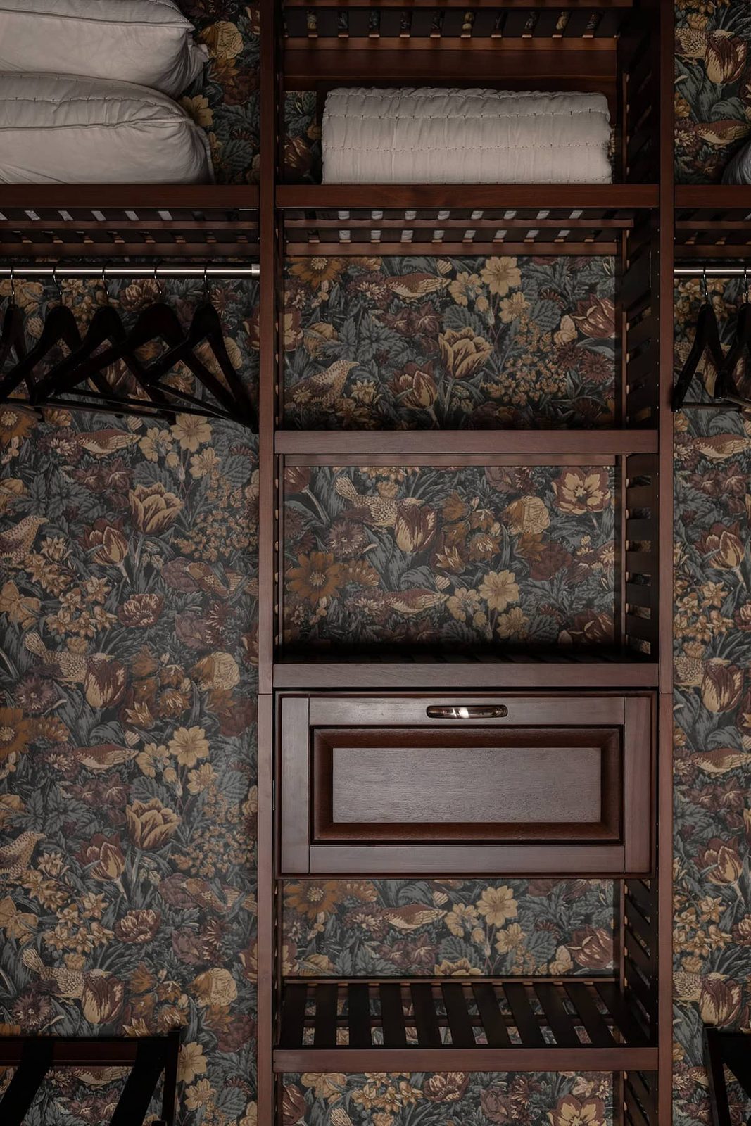 closet with floral wallpaper and wood system from lowes