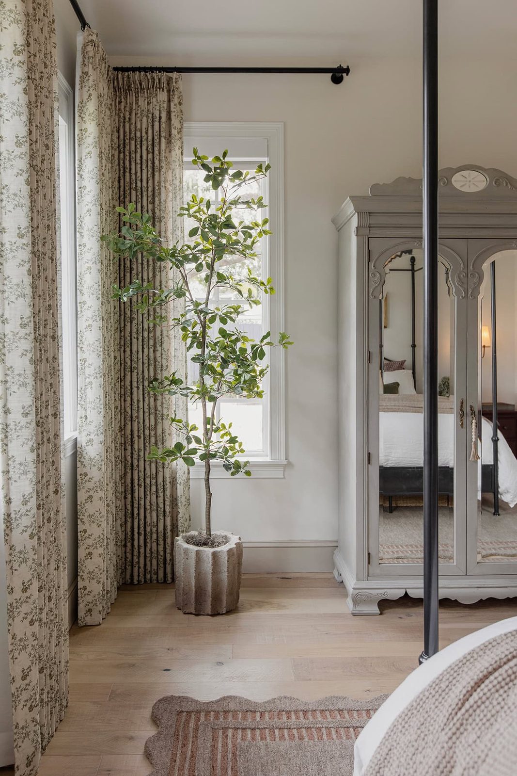 master bedroom with loloi scottie rug, twopages sarale curtains, faux black olive tree