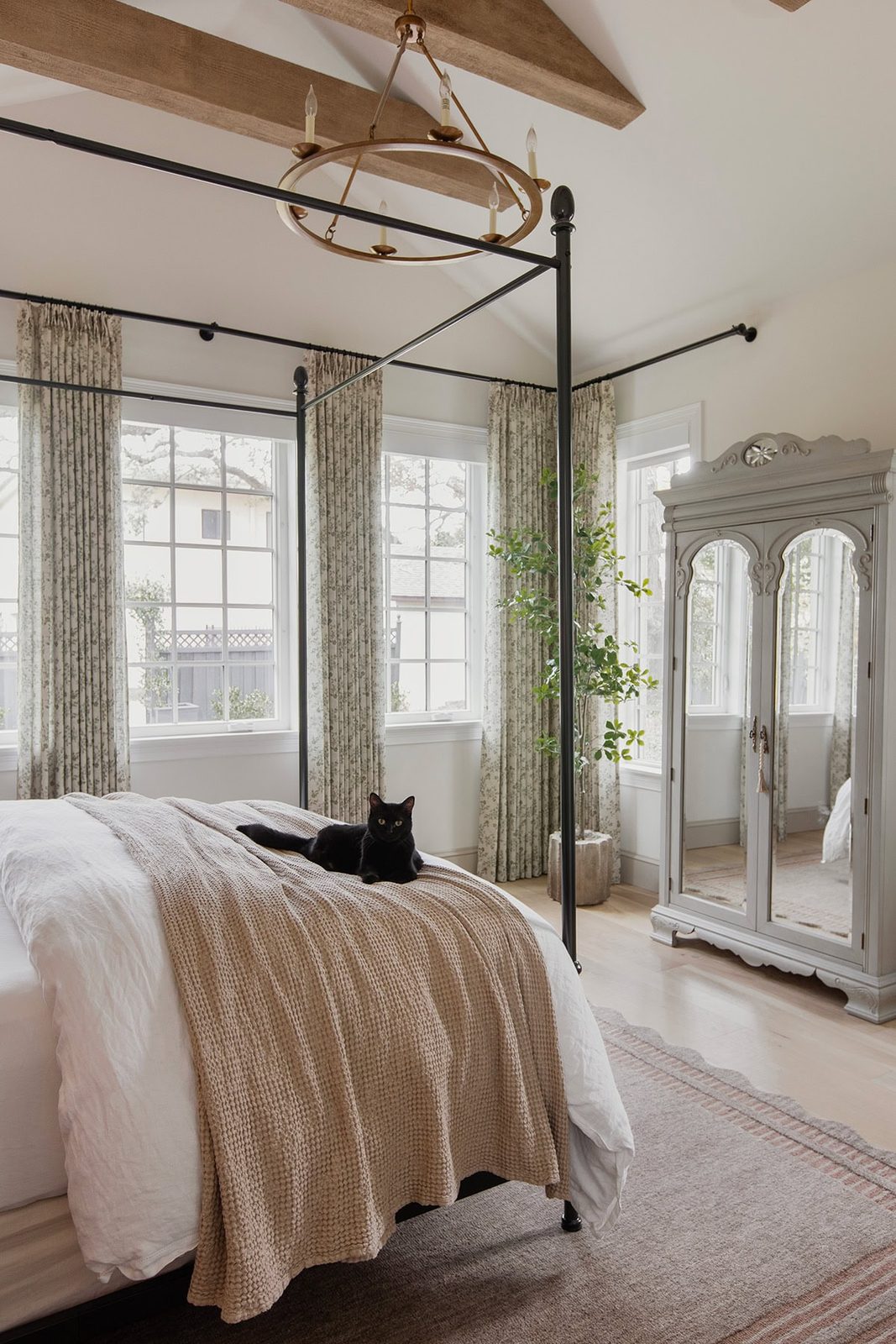 master bedroom with loloi scottie rug, twopages sarale curtains, canopy bed