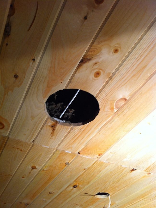 installing speakers on a wood plank ceiling