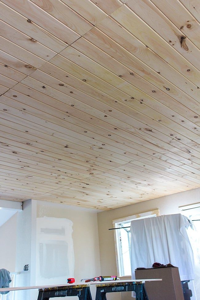 pine wood plank ceiling installation
