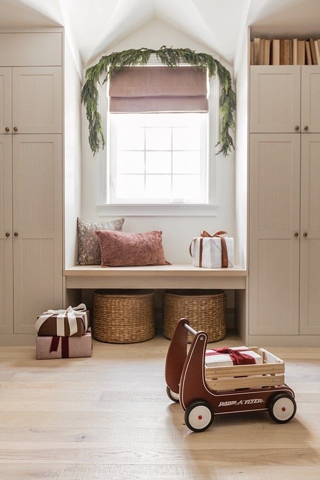 neutral playroom holiday decor with window garland
