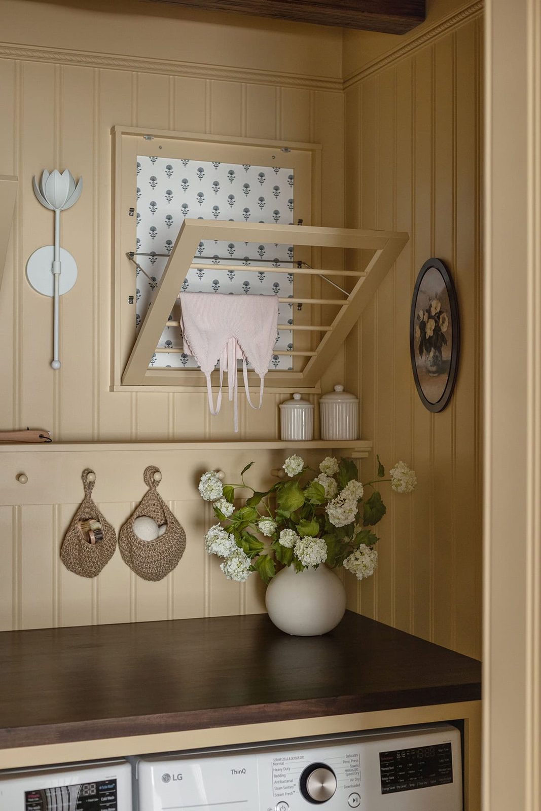 yellow laundry room with bead board walls