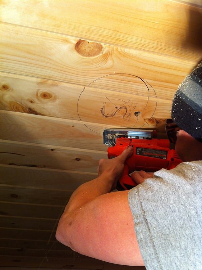 installing speakers on a wood plank ceiling