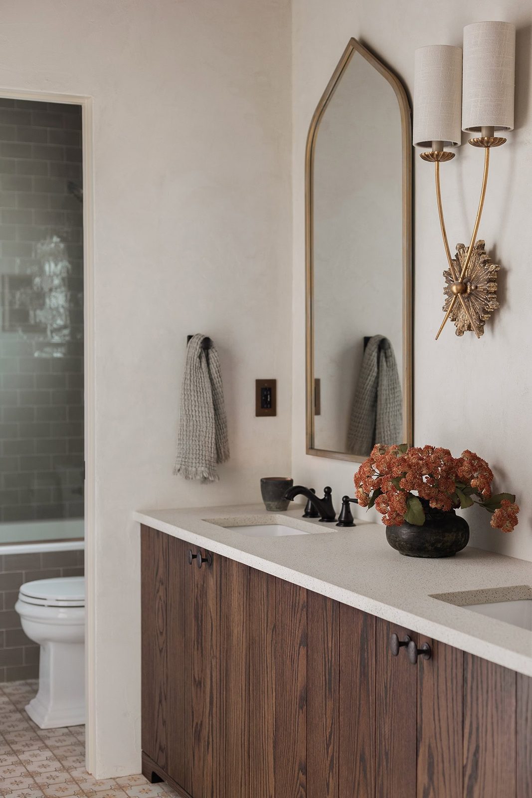 spanish inspired bathroom with dark oak vanity