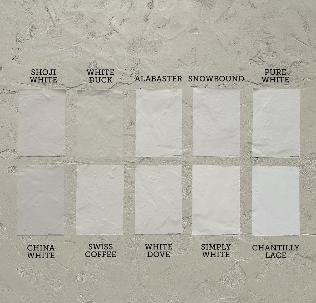 best white exterior paint color comparison on stucco in sunlight
