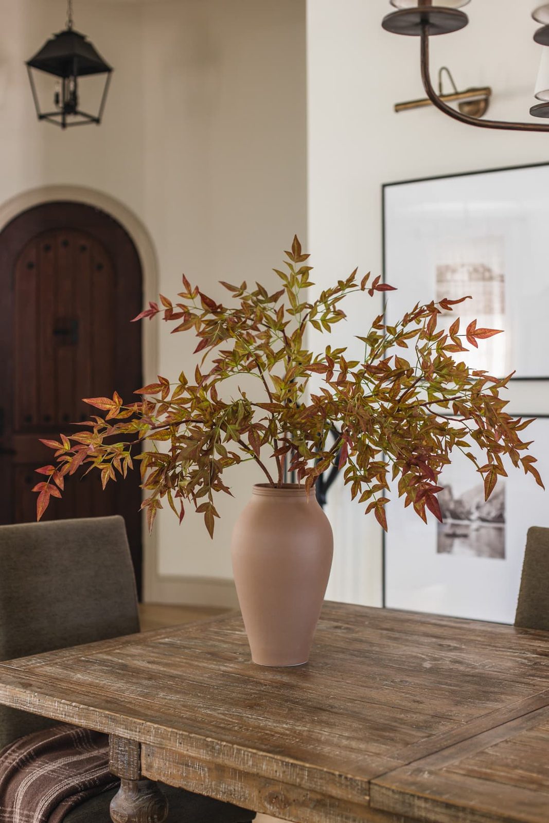 faux nandia fall branches in vase on dining table