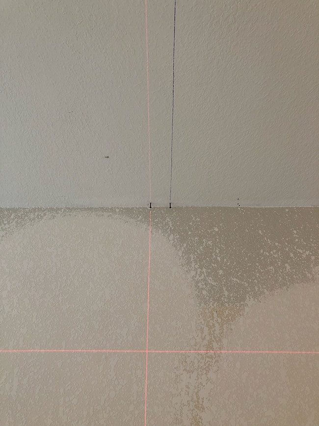 using a laser level to mark lines on a ceiling