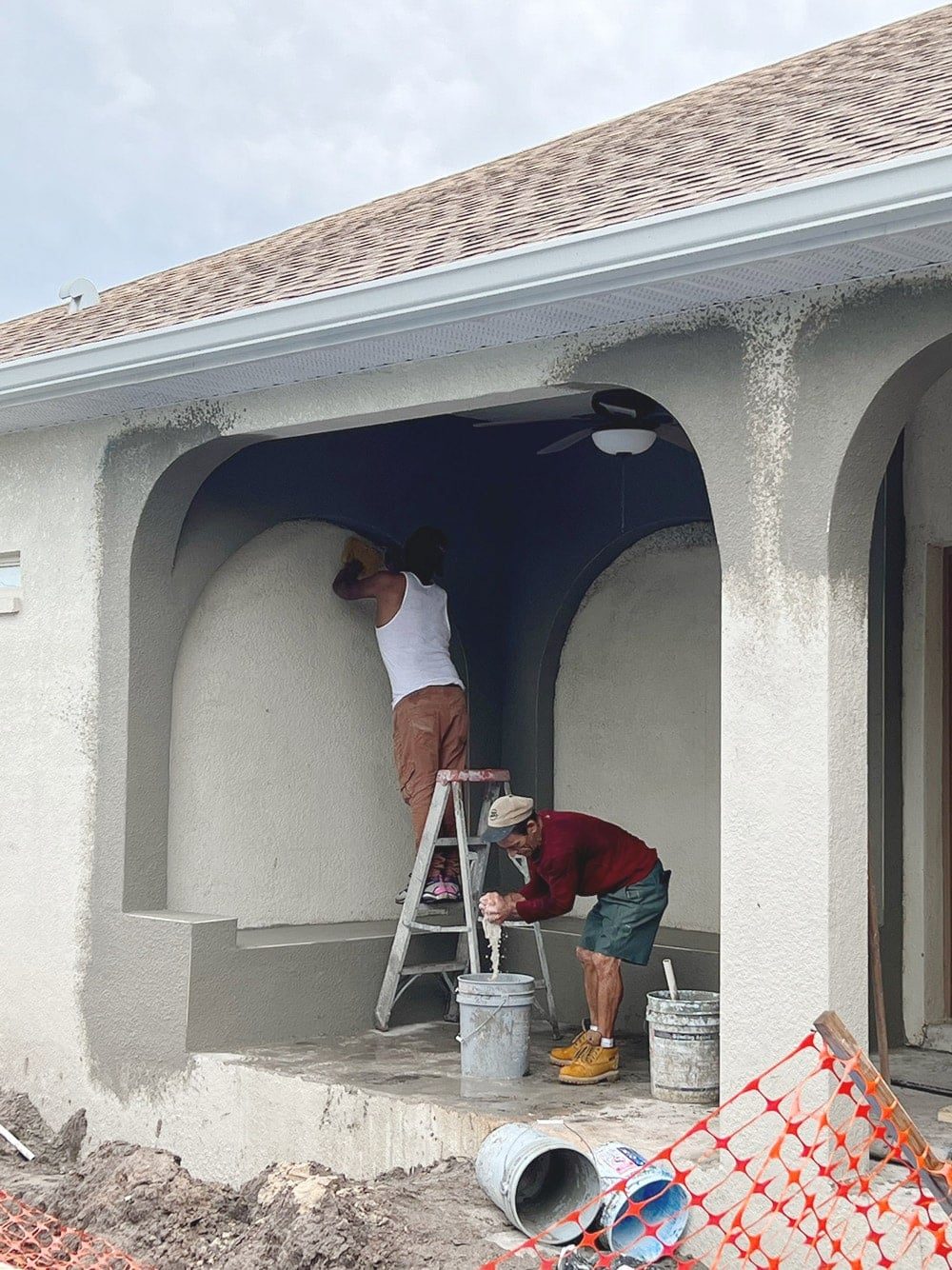 diy custom stucco arches on a covered porch