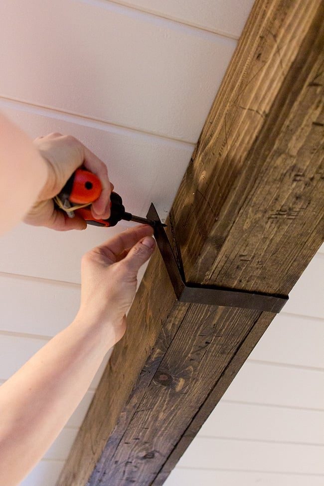 adding black straps to wood ceiling beams