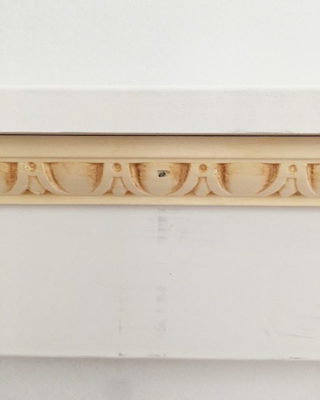 closeup of decorative chair rail on board and batten